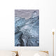 A close-up view of glacial ice strewn across a coastal beach Wall Mural