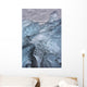 A close-up view of glacial ice strewn across a coastal beach Wall Mural