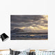 Shafts of sunlight shine on the ice calves floating Wall Mural