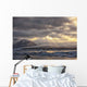 Shafts of sunlight shine on the ice calves floating Wall Mural