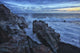 Waves crash over the shoreline along the beach of djupalonssandur Wall Mural