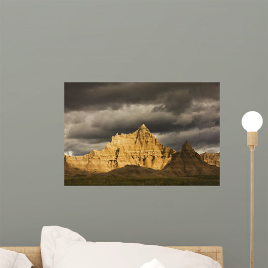 Dramatic light during a storm in badlands national park Wall Mural
