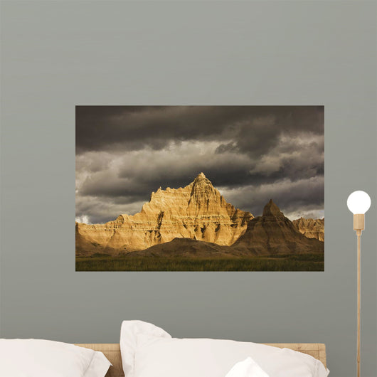 Dramatic light during a storm in badlands national park Wall Mural