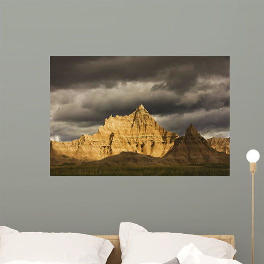 Dramatic light during a storm in badlands national park Wall Mural