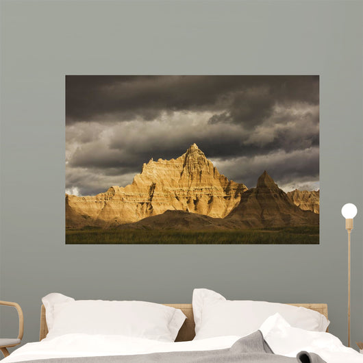 Dramatic light during a storm in badlands national park Wall Mural