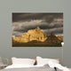 Dramatic light during a storm in badlands national park Wall Mural
