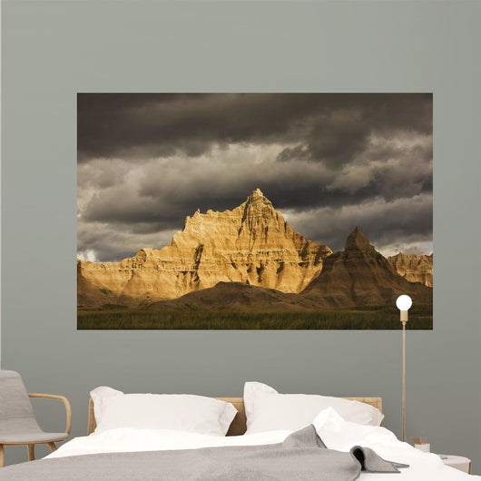 Dramatic light during a storm in badlands national park Wall Mural