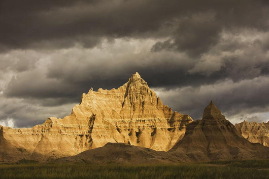 Dramatic light during a storm in badlands national park Wall Mural