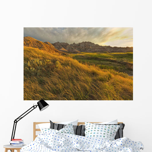 Sunset over the landscape of badlands national park Wall Mural