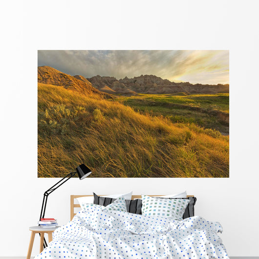 Sunset over the landscape of badlands national park Wall Mural