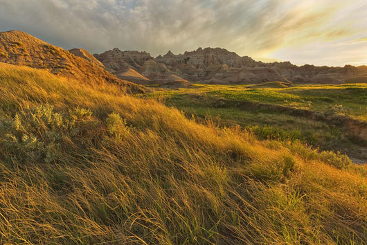 Sunset over the landscape of badlands national park Wall Mural