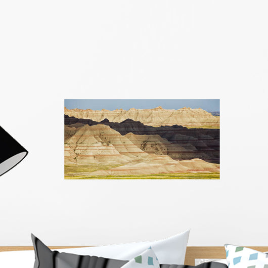 Light and shadows paint the landscape of badlands national park Wall Mural