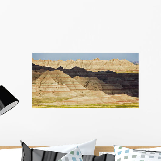 Light and shadows paint the landscape of badlands national park Wall Mural