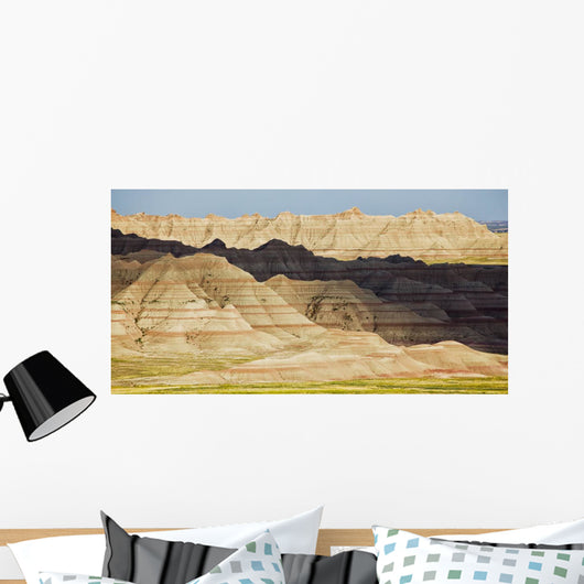Light and shadows paint the landscape of badlands national park Wall Mural