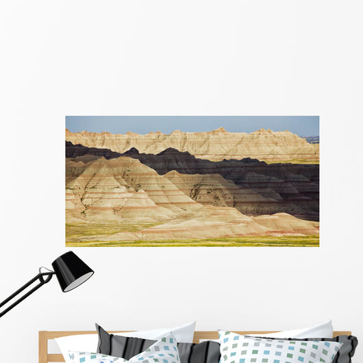 Light and shadows paint the landscape of badlands national park Wall Mural