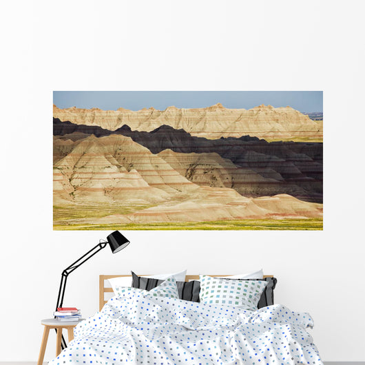 Light and shadows paint the landscape of badlands national park Wall Mural