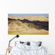 Light and shadows paint the landscape of badlands national park Wall Mural