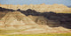 Light and shadows paint the landscape of badlands national park Wall Mural