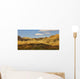 Dramatic light on the eroded formations of badlands national park Wall Mural