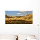 Dramatic light on the eroded formations of badlands national park Wall Mural
