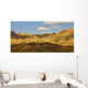 Dramatic light on the eroded formations of badlands national park Wall Mural