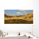 Dramatic light on the eroded formations of badlands national park Wall Mural