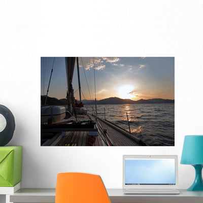 Sailing Boat Sea Sunset Wall Mural shown on a wall