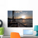 Sailing boat in the sea at sunset Wall Mural