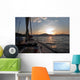 Sailing boat in the sea at sunset Wall Mural