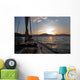 Sailing boat in the sea at sunset Wall Mural