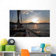 Sailing boat in the sea at sunset Wall Mural