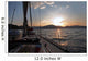 Sailing boat in the sea at sunset Wall Mural