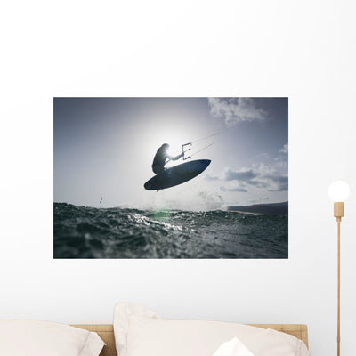Kitesurfer His Board Mid-air Wall Mural shown on a wall