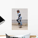 child skateboarding with helmet, knee pads and elbow protection Wall Mural