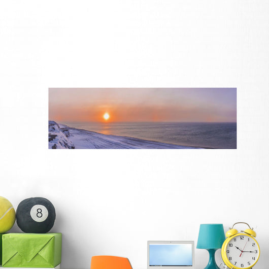 Sunset through windblown snow creates a sundog above the Beaufort Sea Wall Mural