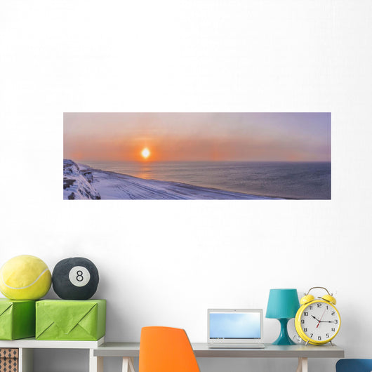 Sunset through windblown snow creates a sundog above the Beaufort Sea Wall Mural