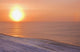 Sunset through windblown snow creates a sundog above the Beaufort Sea Wall Mural