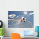 Soccer ball in the net on the sky background Wall Mural