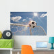 Soccer ball in the net on the sky background Wall Mural