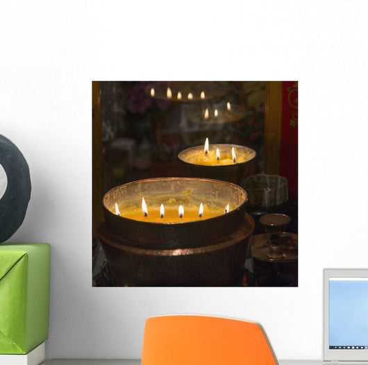Flames burning in a row in large bronze pots;Lhasa xizang china Wall Mural