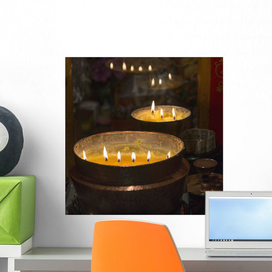 Flames burning in a row in large bronze pots;Lhasa xizang china Wall Mural