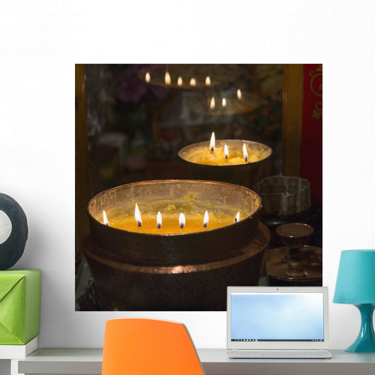 Flames burning in a row in large bronze pots;Lhasa xizang china Wall Mural