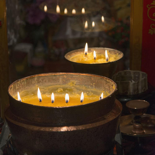 Flames burning in a row in large bronze pots;Lhasa xizang china Wall Mural