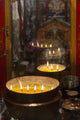 Flames burning in a row in large bronze pots;Lhasa xizang china Wall Mural