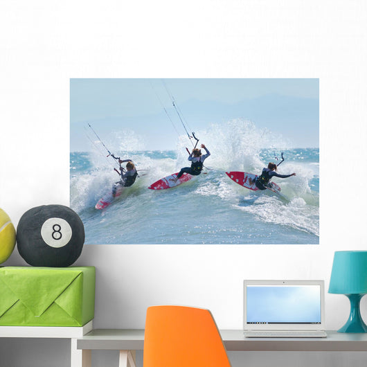 Three kitesurfers in water Wall Mural