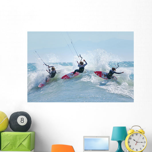 Three kitesurfers in water Wall Mural