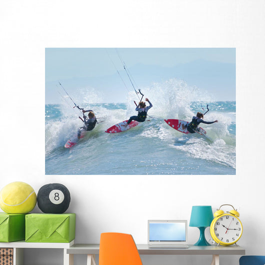 Three kitesurfers in water Wall Mural