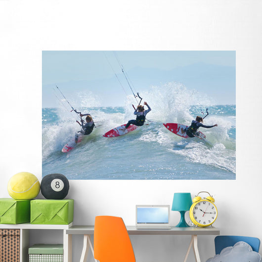 Three kitesurfers in water Wall Mural