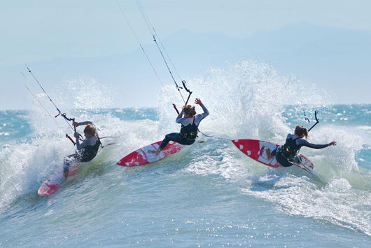 Three kitesurfers in water Wall Mural