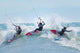 Three kitesurfers in water Wall Mural